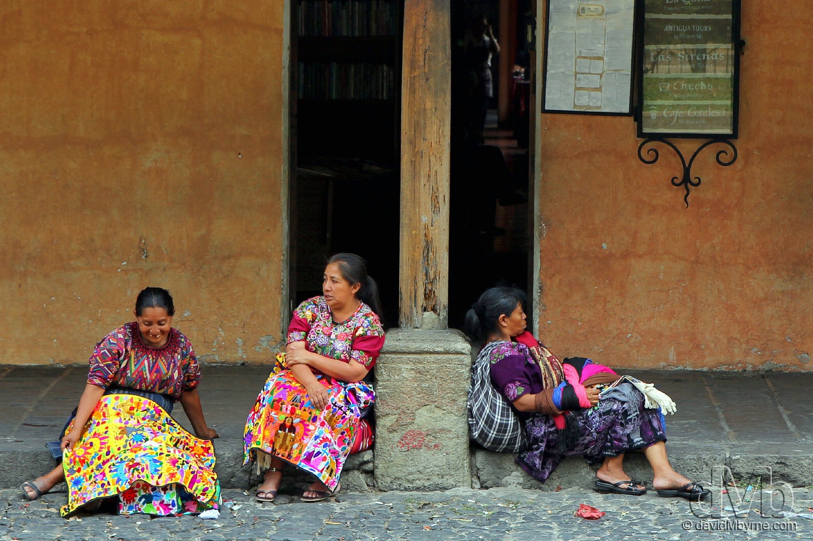 Three Mayan ladies taking a break from peddling their wares by the edge of Parque Central, Antigua, Guatemala. May 19th, 2013 (EOS 60D || Tamron 28-75 || 75mm, 1/250sec, f/4.5, iso100)