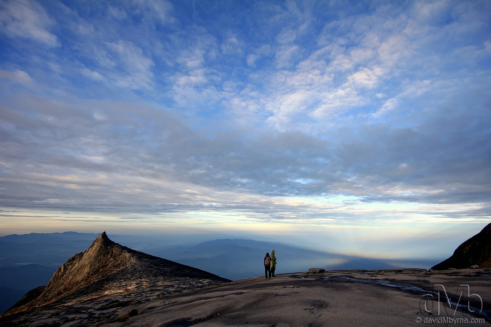 Climbers on the granite expanse leading to the summit of Mount Kinabalu shortly after sunrise. Sabah, Malaysian Borneo. June 23rd, 2012 (EOS 60D || Sigma 10-20mm || 10mm, 1/125sec, f/8.0, iso100) 